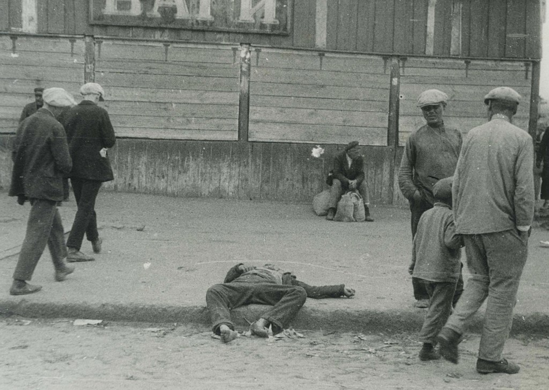 Victim of the Holodomor lying on a sidewalk in Kharkiv, Ukraine, photo by Alexander Wienerberger, 1932 or 1933.