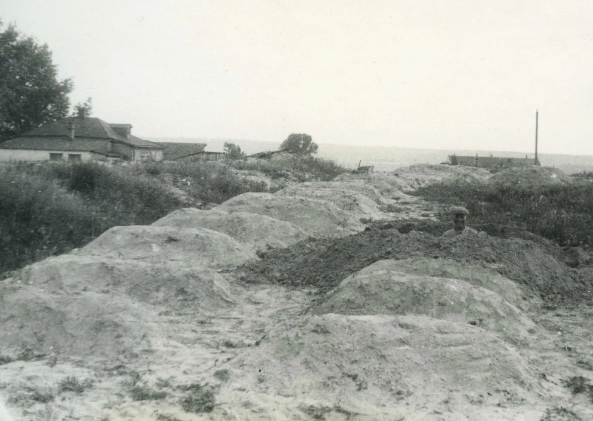 Mass graves filled with victims of the Holodomor, Kharkiv, Ukraine, photo by Alexander Wienerberger, 1933.